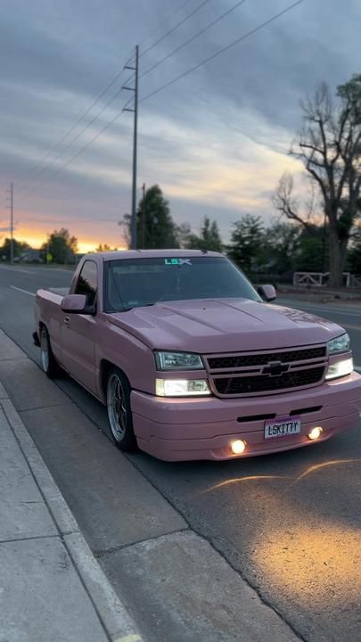 Pink Chevy Spark, Pink Gmc Truck, Grey Dodge Charger With Pink, Pink Chevy Trucks Old, Pink Chevy Trucks, Pink Trucks, White Lifted Truck With Pink Lights, Pink Chevy, Low Trucks