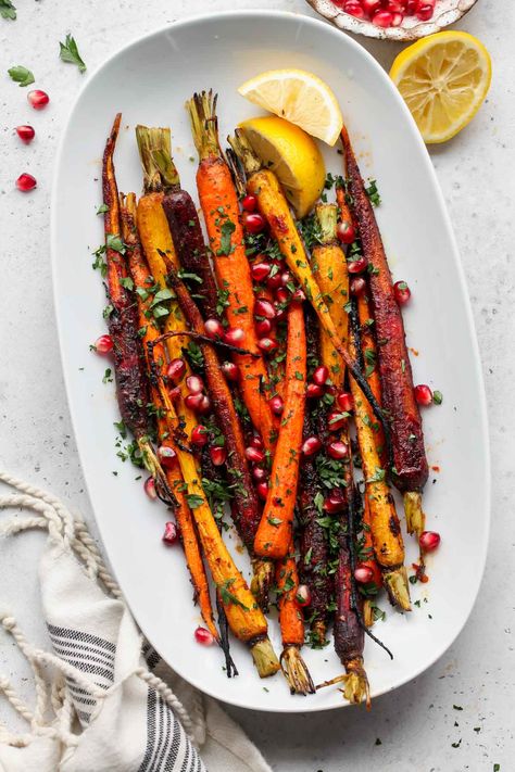 Harissa-Honey Roasted Carrots with Pomegranate and Parsley are a restaurant-worthy side dish. With minimal ingredients and bold flavors, these rainbow carrots pair well with any protein or entree. via @https://www.pinterest.com/jamievespa/ Winter Carrot Recipes, Harissa Roasted Carrots, Thanksgiving Roasted Carrots, Carrot Roasted, Harissa Carrots, Hosting Recipes, Balsamic Carrots Roasted, Roast Carrots, Paris Dinner