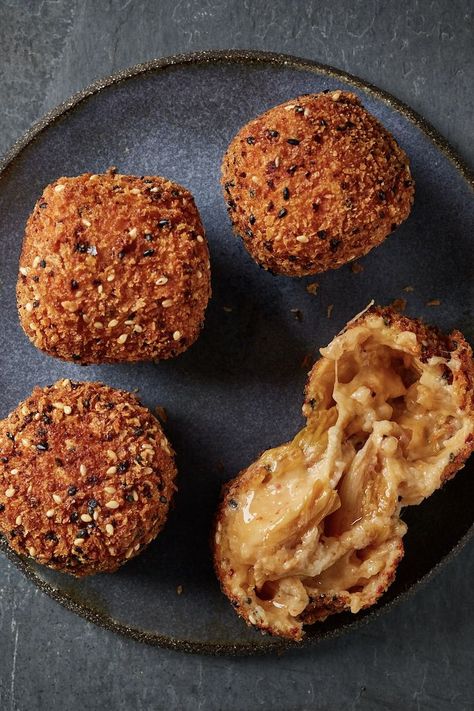 These bechamel-based cheese croquettes are spiked with the tang and complexity of kimchi. Crisp on the outside and silky in the centre, they're served with a doenjang (soy bean paste) mayonnaise for dipping. Kimchi Croquette, Croquettes Vegetarian, Asian Tapas, Cheese Croquettes, Croquettes Recipe, Canapes Recipes, Soy Bean, Pub Food, Fusion Food