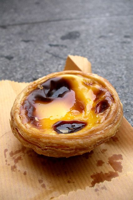 pastéis de nata | eating a warm egg tart on the steps of the… | Flickr Pastel Brazil, Portugese Custard Tarts, South African Desserts, Portuguese Egg Tart, African Dessert, Portuguese Desserts, Custard Tart, Egg Tart, Portuguese Recipes