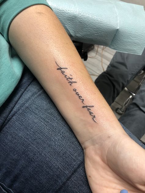 Small Tattoos Scripture, Women Small Wrist Tattoos, Forearm Tattoos Women Small, Chest Tattoo Female Collar Bone, Montani Semper Liberi Tattoo, Word Forearm Tattoos For Women, Forearm Tattoo Women Small Quotes, Forearm Word Tattoo Women, Forearm Quote Tattoo Women