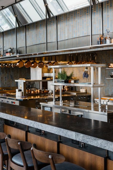 an open kitchen with a counter lined with stools Open Kitchen Bar Design, Open Kitchen Design Restaurant, Open Kitchen Cafe, Open Kitchen Restaurant Design, Open Kitchen Bar, Kitchen Restaurant Design, Open Kitchen Restaurant, Restaurant Kitchen Design, Commercial Kitchen Design