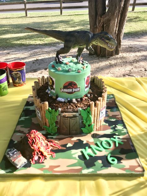 Jurassic Park dinosaur cake, with mini volcano cake and Pirouettes and edible images for the signs and door. Dinosaur Volcano Cake, Dinosaur Cake Ideas, Mini Volcano, Jurassic Park Cake, Dino Cakes, Dinosaur Jurassic Park, Jurassic World Cake, Jurassic Park Birthday Party, Volcano Cake