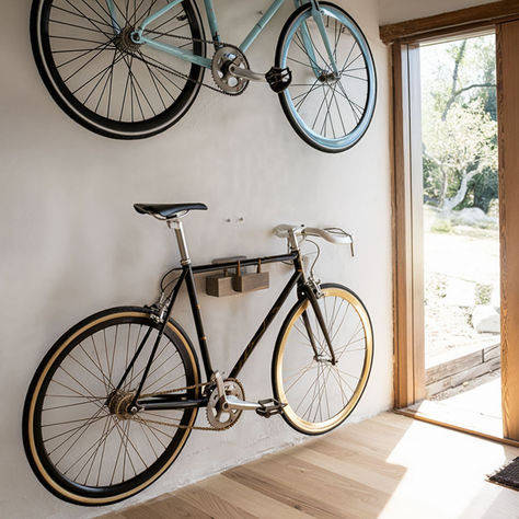 7 Fantastic Storage Ideas for Your Bike Garage Storage Bikes, Hang Bikes In Garage, Wall Bike Storage, Bicycle Storage Ideas, Garage Bike Storage Ideas, Bike Storage Garage Wall, Wall Bike Rack, Bike Storage Ideas, Garage Bike Storage