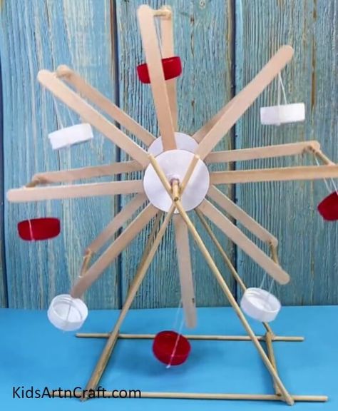 DIY Recycled Sticks And Bottle Caps Ferris Wheel Craft Tutorial For Kids Check more at https://www.kidsartncraft.com/ferris-wheel-craft-tutorial/ Mr Ferris And His Wheel Activities, Ferris Wheel Project, Wheel Crafts For Preschoolers, Ferris Wheel Craft, Diy Ferris Wheel, Skeleton Project, Wheel Crafts, Carnival Crafts, Wheel Craft