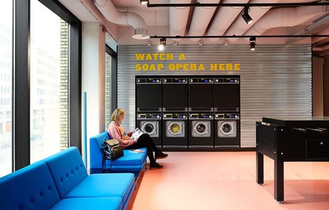 This modern hotel has a laundry room with comfortable blue couches and games to play. Laundromat Business, Student Hotels, Architecture Design Ideas, Laundry Business, Bright Furniture, Unique Murals, Hotel Meeting, Student Room, Laundry Shop