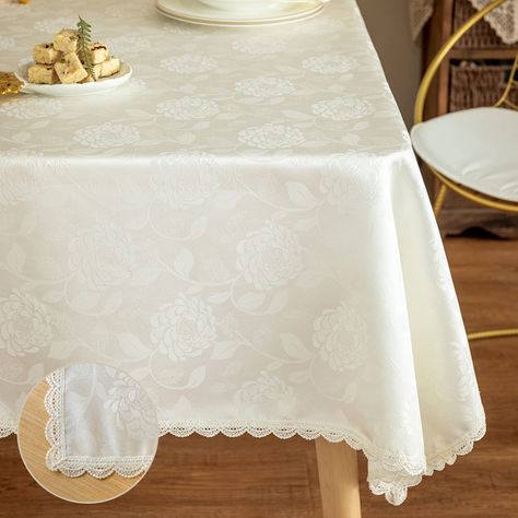 PRICES MAY VARY. [MASTERFUL DESIGN]:Ivory damask textured fabrics with luxury and vivid jacquard craftsmanship, rose petal pattern,delicate lace edge designs make the tablecloth natural and elegant.This table cloth will make your meal time more pleasent and luxurious. Suitable for dining room, kitchen room, patio, gardens, outdoor, family room and decoration. [PREMIUM QUALITY]:High-grade jacquard fabric with excellent water proof and soil release founction,which make the tablecloth very easy to Rectangle Table Cloth, Patio Gardens, Textured Fabrics, Fabric Table, Round Table Covers, Floral Tablecloth, White Table Cloth, Kitchen Dinning, How To Clean Iron