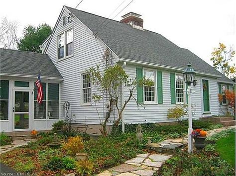 1950s cape cod enclosed porch | One owner charming Cape Cod style home with rear dormer. This cape is ... Pretty Landscaping, Sunroom Deck, Cape Cod Style Home, Cape Cod House Exterior, Manchester Home, Wooded Lot, Gable House, Front Stoop, Enclosed Porch