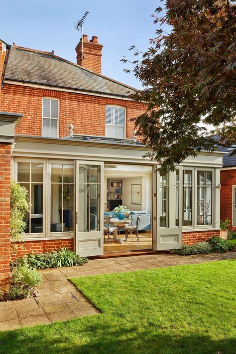 A traditional Orangery Extension is timeless and classic in style. This Orangery extension is complete with a Humphrey Munson Kitchen. Its appearance blends seamlessly with a variety of differently styled properties. The original building, having had the opportunity to soften into the landscape over time, requires an addition that is sympathetic to its established surroundings. Kitchen To Garden Extension, Extension Decor Ideas, Orangery Extension With Log Burner, Extension Window Ideas, Orangery Style Extension, Traditional Extension Ideas, Orangery Kitchen Extension, Rear Extension Ideas Semi Detached, 2 Storey Extension Ideas