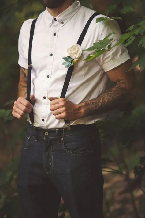 black jeans, an ivory short sleeve shirt with black buttons and black suspenders Tattoos Artistic, Suspenders Jeans, Whimsical Woodland Wedding, Boho Wedding Groomsmen, Casual Groomsmen, Groom Casual, Casual Groom Attire, Jeans Wedding, Casual Grooms