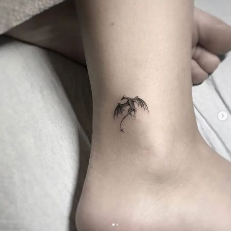 Minimalist Tiny Dragon Tattoo | TattooDesign Dragon Ankle Tattoo, Targaryen Tattoo, Tattoo Ankle, Dragons Tattoo, Small Dragon Tattoos, Small Dragon, Tattoo Placements, Dragon Tattoo For Women, Men Tattoos