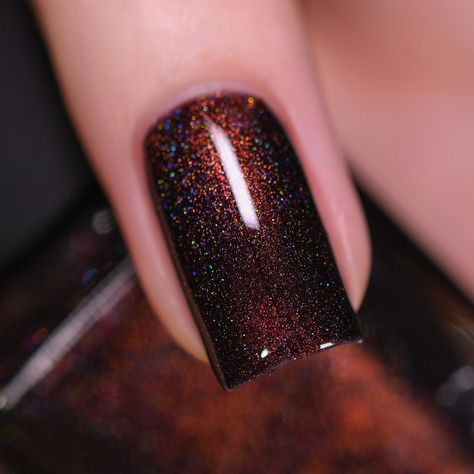 Dash of Cocoa is a delectable dark chocolate holographic nail polish with a standout red-to-gold center. Lounge near the fireplace with Dash of Cocoa, an irresistible holographic with an intense red center that ignites like a warm, lively flame! Subtly shifting from red to gold, the intensely deep chocolate base of Dash of Cocoa pairs perfectly with color-shifting shimmer to create an impressionably sharp and luscious finish loaded with contrast! Dash of Cocoa is part of the 'Tis The Season Coll Dark Shiny Nails, Brown Burgundy Nails, Deep Maroon Nails, Maroon Fall Nails Burgundy, Dark Brown Chrome Nails, Nail Colors Winter Classy, Brown Sparkle Nails, Dark Chocolate Nails, Hot Chocolate Nails