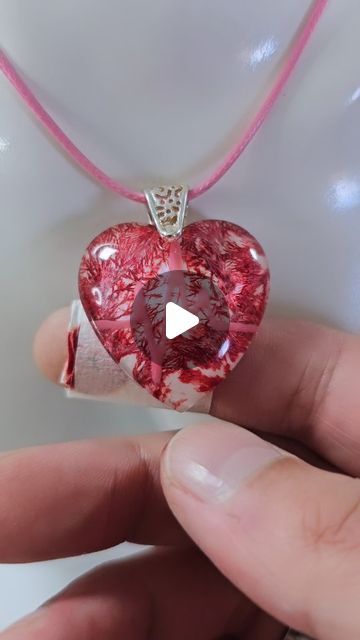 Daniel Cooper on Instagram: "The Blood Heart ❤️  Making a blood heart resin jewelry pendant with a heartbeat.  The growing vein stuff is Frost Paint from Vallejo.  The red is alcohol ink, NOT REAL BLOOD! The FAKE plaster is also just red alcohol ink on tissue with tape wrapped around it 😂 Let's see how many people do not read the description 😉😂  Resin jewelry, resin jewellery, resin art, resin, jewelry making, jewellery making  #resinart #resin #jewelrymaking" Resin Ink Jewelry, Resin Heart Pendant, Red Alcohol, Resin Jewelry Pendants, Jewellery Resin, Blood Heart, Alcohol Ink Jewelry, Heart Resin, Making Jewellery