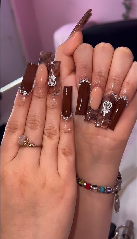 Brown Xxl Acrylic Nails, Brown Nail Inspo Square, Brown Junk Nails, Brown Glam Nails, Tapered Square Fall Nails, Brown Nails With Charms, Brown Tapered Square Nails, Brown Acrylic Nails With Rhinestones, Brown Y2k Nails