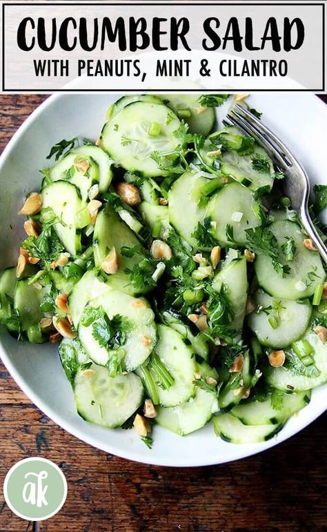 Samin Nosrat's Vietnamese cucumber salad — so refreshing! This salad is big on the acid — lime + rice vinegar — and the herbs — cilantro + mint — and tastes spicy, sweet, crunchy, and salty all at once thanks to jalapeños, sugar, peanuts, and fish sauce. Heaven in a bowl! #cucumber #peanuts #cilantro #mint #salad #vietnamese Vietnamese Cucumber, Samin Nosrat, Growing Cilantro, Resep Salad, Cucumber Salad, Cooking Kitchen, Fresh Herbs, Cilantro, Asian Recipes