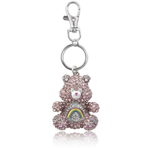 PRICES MAY VARY. Officially Licensed Care Bears Keychain: Carry happiness with you wherever you go with a cute key chain featuring vintage Care Bears. Encrusted in multicolored crystals, Cheer Bear pendant charm dangles from the rhodium-plated keychain Lobster Clip: Lobster claw clip is attached to the keychain ring to easily attach this kawaii keychain to other keys, a belt loop, lanyard, or bag Accessorize Your Bag, Backpack or Purse: Use as backpack charms or purse charms for a fun look. Make Bedazzled Keychain, Cheer Keychain, Car Keychain Ideas, Cheer Bear, Hello Kitty Keychain, Cool Keychains, Keychain Ideas, Bear Keychain, Backpack Accessories