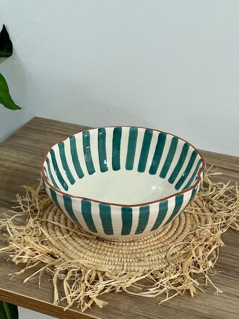 ✨ Infuse your table with the elegance of Moroccan artistry with this exquisite handmade ceramic salad bowl. Perfect for serving salads, fruits, or any favorite dish, this bowl blends traditional craftsmanship with modern design, making it a standout addition to your kitchen. 𝗙𝗲𝗮𝘁𝘂𝗿𝗲𝘀: ✤ Artisanal Craftsmanship: Handcrafted by skilled Moroccan artisans, each bowl is a unique masterpiece, showcasing the rich tradition of Moroccan pottery. ✤ Distinctive Design: Featuring wavy sides and vert Ceramic Salad Bowl Handmade, Pottery Painting Ideas Salad Bowl, Colorful Ceramic Bowls, Pottery Painting Salad Bowl, Pottery Pasta Bowl, Paint Bowl Ideas, Bowl Ceramic Design, Fruit Bowl Pottery, Moroccan Ceramics