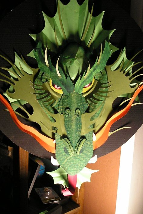 I used cardboard to make this art piece. Look at the pictures and view the image notes to see how it was constructed. Cardboard Dragon, She Kills Monsters, Medieval Party, Origami Dragon, Theme Harry Potter, Folding Origami, Dragon Crafts, Dragon Birthday, Dragon Costume