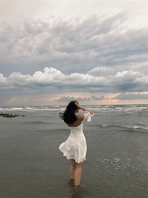 Sea side, pose, inspiration, white dress, clouds, photo shoot, aesthetic, beach, summer, august White Dress In Beach Aesthetic, Beach Side Pictures, Beach Side Photos, White Dress On Beach Photoshoot, White Dress Beach Aesthetic, White Beach Dress Photoshoot, Beach Side Poses, Beach Photo Shoot Dress, Beach Side Aesthetic