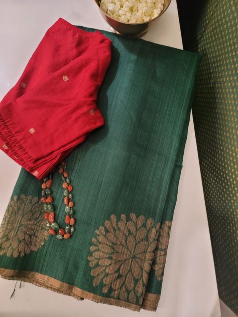 Forest green Matka silk saree with large floral weave above the selvedge through out the body in gold zari. The pallu of the saree is also woven in Forest green with large floral pattern as in the body. Overall, this saree is a stylish and sophisticated choice for a formal occasion and it will be a timeless and elegant addition to any wardrobe. Blouse: Forest green Matka silk self Green Cotton Saree, Geranium Color, Matka Silk Saree, Beaded Wedding Jewelry, Green Carnation, Blouse Colour, Katan Saree, Blouses Designs, Desi Outfits