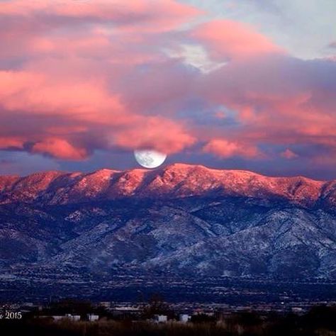 Sensational photo of the moon over New Mexico's Sandia Mountains. On some days there is a small window of time at sunset that the Sandia's turn a watermelon color. I timed it once at about five minutes.  I recall, in particular, a bright Harvest Moon one year that was huge and rising over the Sandias at dusk while they were in watermelon mode, not a cloud in the sky.Albuquerque Now's photo.  Albuquerque Now's photo. Sandia Mountains, Duke City, Mountains Photo, New Mexico Homes, Mexico Culture, Santa Fe Style, Moon Rising, Albuquerque New Mexico, Land Of Enchantment