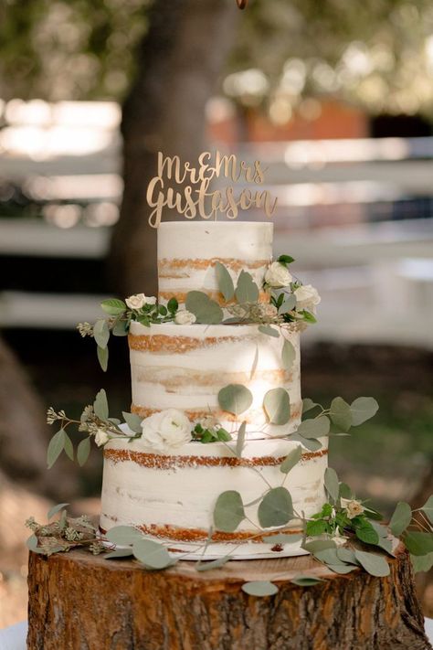 This contains an image of: Sage and White Fairytale Wedding in the Fall Wedding Cake Designs Elegant Sage Green, Sage Cake Wedding, Bohemian Sage Green Wedding, Sage Green Rustic Wedding Cake, Rustic Wedding Cake Eucalyptus, Rustic Wedding Sage Green, Sage And Blush Rustic Wedding, Wedding Cake For Outdoor Wedding, Sage Green And Peony Wedding