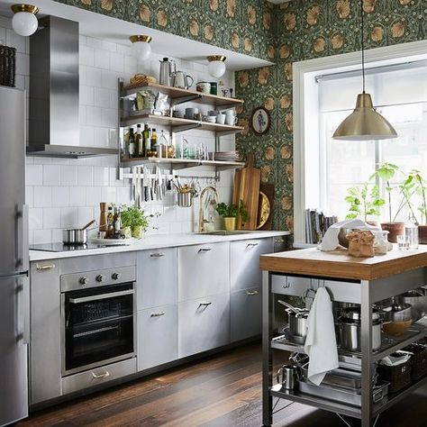 Caution: These 8 Stainless Steel Kitchen Cabinet Ideas Are Blindingly Beautiful | Hunker Ikea Small Kitchen, Dapur Skandinavia, Hiasan Dalaman Dapur, Dapur Ikea, Dapur Moden, Ikea Kitchen Storage, Modern Konyhatervezés, Stainless Steel Kitchen Island, Stainless Steel Kitchen Cabinets