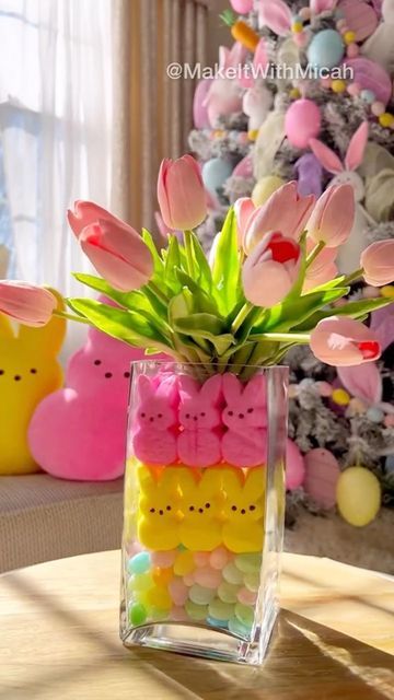 Micah ︳DIY • Decor • Dollar Tree • Amazon Finds on Instagram: "Easter DIY Candy Centerpiece 🐰 The vase is thrifted and the tulips are from Amaz0n (see B!0). The remaining decor is from Home Goods/TJ Maxx. The jumbo peeps are from Target (last year). Questions encouraged! 💗 #easterdecor #eastercenterpiece #diy #diyhomedecor #easterdiy #spring #centerpieces #diycenterpieces" Easter Vase With Peeps, Easy Easter Centerpieces Diy, Easter Vase Filler Ideas, Easter Tablescapes Ideas Dollar Stores, Easter Candy Ideas, Peeps Centerpiece, Easter Centerpieces Diy Dollar Tree, Easter Recipes Ideas, Holidays Treats