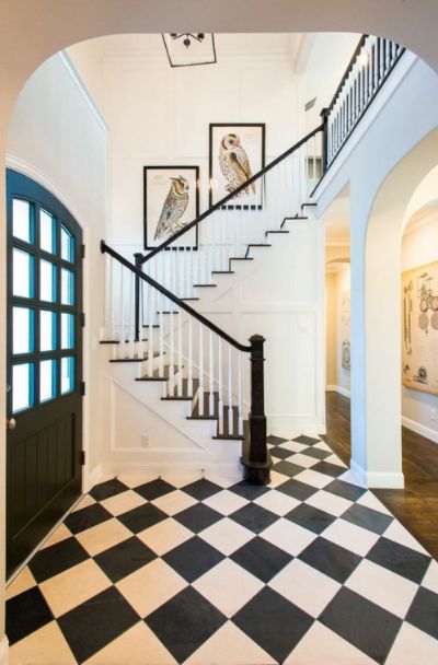 31 Houses With Black Front Entry Door Ideas - | Sebring Design Build Black And White Hallway, Black And White Stairs, Black Staircase, Classic Carpet, Wood Stair Treads, Carpet Staircase, White Hallway, Entryway Tile, White Staircase