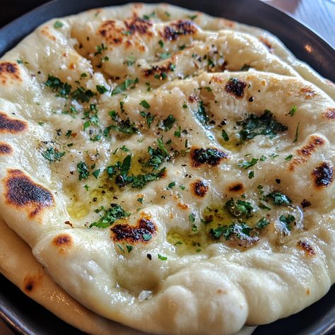 Naan originated in the Indian subcontinent and has been a staple in Indian cuisine for centuries. The word "naan" itself comes from the Persian word for bread, but it was introduced to India through the Mughal Empire. Traditionally baked in a tandoor oven, naan is known for its soft, fluffy texture and slight char.   #GarlicNaanGoodness #HomemadeBread #NaanLove #FluffyNaan #IndianRecipes #EasyBaking #BreadLovers #GarlicLovers #PerfectSideDish Bread Naan, Tandoor Oven, Indian Subcontinent, Garlic Naan, Mughal Empire, Fluffy Texture, Perfect Side Dish, Naan, Homemade Bread