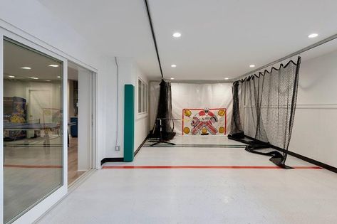 Basement Hockey Room with Black Nets - Transitional - Basement Basement Hockey, Hockey Man Cave, Transitional Basement, Basement Craft Rooms, Basement Movie Room, Hockey Nets, Contemporary Basement, Hockey Room, Basement Games