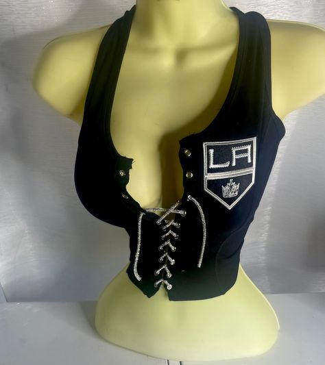 LA Kings Crop Tank Top- Black with a silver rhinestone lace.   Please note estimated time to ship these items is 7-10 business days as they are made to order. If you need it right away please send us a message and we will try our best to accommodate your request.  Don't see your team? Send us a message with a request and we will gladly accommodate it. Edgy Crop Top Tank Top, Y2k Club Crop Top Camisole, Black Cropped Y2k Tank Top, Black Y2k Tank Strap Crop Top, Y2k Crop Tank Top With Built-in Bra, Diy Cut Shirts, Crop Top Jacket, Pink Clothes, Black Crop Top Tank