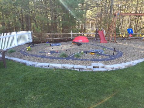 My husband created the ultimate play area for our kids: outside race track, monster truck pit , airport & pond. Dump Truck Play Area, Reggio Playground, Kids Outdoor Play Area Ideas, Outdoor Play Area Ideas, Kids Outdoor Play Area, Kids Race Track, Gravel Pit, Playground Landscaping, Kids Backyard Playground