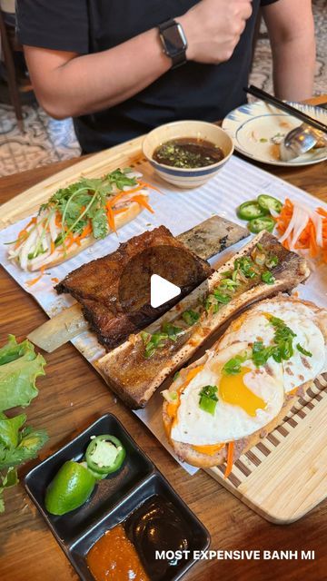 Allie Tong | Food + Recipes on Instagram: "Bougie banh mi anyone?? 😛 At $49, this is probably the most expensive and biggest (and certainly messiest) banh mi ever! The Banh Mi Zilla at @gaovietkitchen comes with brisket, bone marrow, eggs, a side of brisket pho, and au jus for dipping. But it’s only available when @mr.gaoviet is there 😉" Pork Banh Mi, Vietnamese Recipes Bahn Mi, Vietnamese Bahn Mi, Brisket Banh Mi, Lemongrass Chicken Banh Mi, Bone Marrow, Banh Mi, Most Expensive