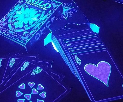 Place a new spin on game night by conducting it in the dark and playing with these black light cards. This one of a kind deck features a psychedelic theme that comes alive once the lights go off and the black light is turned on. Dark Deck, Reading Week, Deck Features, Opi Gel Nails, Light Games, Party Tips, Vegas Trip, Playing Card Deck, Gift Giver