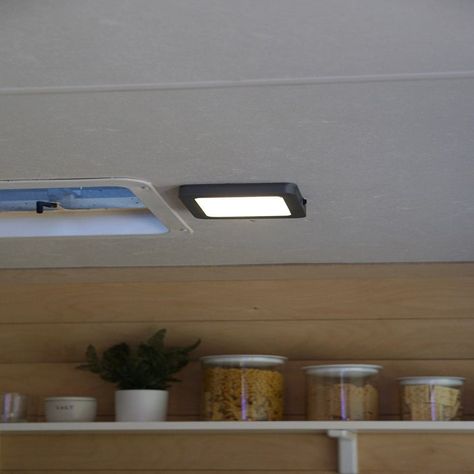 Add some light without any electrical work by using a magnetic LED light that requires absolutely no installation. Replacing Rv Light Fixtures, Rv Lighting Fixtures, Camper Lights, Boat Interior Design, Rv Lighting, Remote Holder, Boat Interior, Electrical Work, Kitchen Upgrades