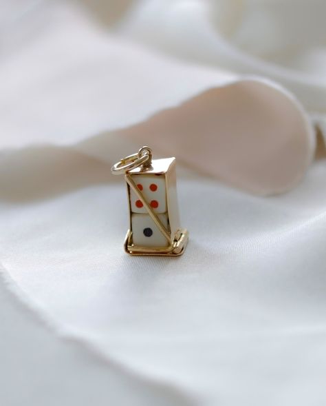 Playful and elegant? Yes please! This 9ct gold dice holder charm is perfect! Featuring a crafted case with two mini dice (white with black & white with red dots), it’s a whimsical yet stylish addition to any bracelet or necklace. 🎲 ✨ Fully hallmarked from 1960, it measures 2cm length, 9mm width, and weighs 1.9 grams—perfect for collectors or as a unique gift. Available now. Link in bio. ✨ #VintageCharm #GoldJewelry #UniqueFinds #CharmBracelet #MyGoldenFinds #GoldJewellery Dice Necklace, Dice Holder, Red Dots, Dots, Black White, Bracelet, Red, Gold, Quick Saves