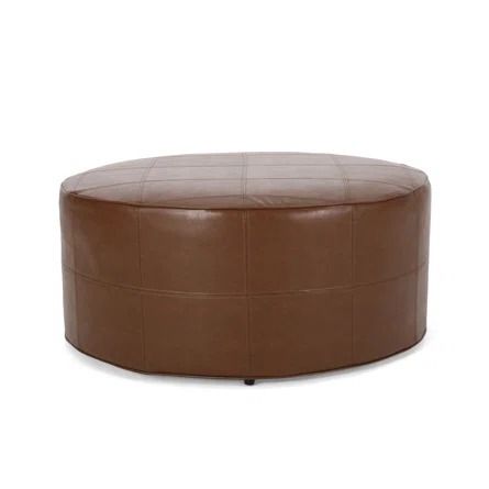 Wade Logan® Avdi Faux Leather Ottoman, Large | Wayfair Faux Leather Ottoman, Upholstered Footstool, Small Ottoman, Earthy Aesthetic, Large Ottoman, Warm Colour Palette, Round Ottoman, Noble House, Upholstered Ottoman