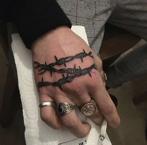 Barbed wire tattoo on the right hand Barbed Wire Tattoo, Traditional Hand Tattoo, Wire Tattoo, Simple Hand Tattoos, Barbed Wire Tattoos, Side Hand Tattoos, Tattoo On Wrist, Skull Hand Tattoo, Knuckle Tattoos