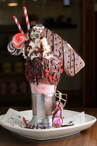 Fort Worth's Vivo 53, these massive sundaes, garnished with everything from an entire ice cream sandwich to delicate macarons and crushed pistachios. Crazy Ice Cream Sundaes, Ice Cream Sundae Aesthetic, Sundae Aesthetic, Crazy Ice Cream, Monster Shakes, Spumoni Ice Cream, Sundae Funday, Crushed Pistachios, Ice Cream Sunday