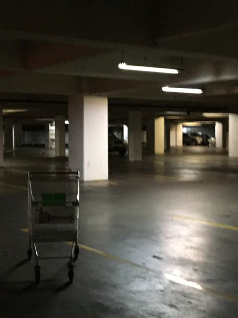 An empty parking lot at night Liminal Space Parking Lot, Empty Parking Lot Night Aesthetic, Parking Lot At Night, Parking Garage Aesthetic, Parking Lot Aesthetic, Liminal Core, Empty Parking Lot, Film Thriller, Funny Feeling