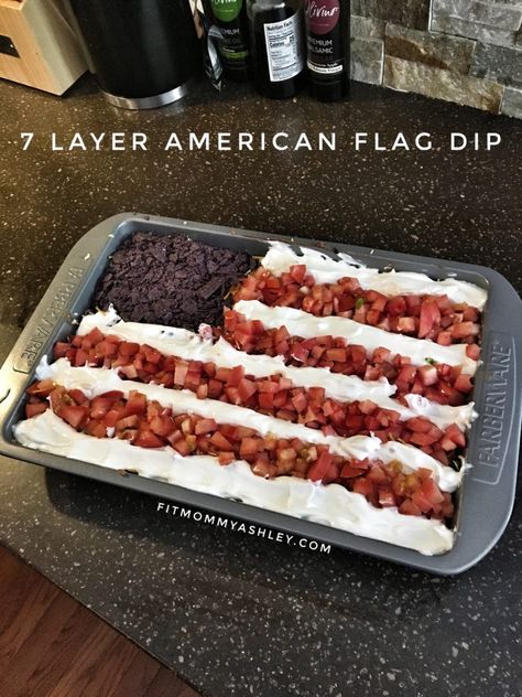 Every patriotic summer barbeque calls for a seven layer dip!  And this is one of our favorites! Super simple.  Healthier alternative than most.  And great for dipping chips or veggies too!   Ingredients:  1 tub plain Greek yogurt 2 cans refried beans (I used organic vegetarian) 1 16oz jar of salsa Shredded romaine lettuce Black olives, sliced Roma tomatoes, finely diced Taco flavored shredded cheese Blue corn tortilla chips Directions:  In a 13×9 baking dish, spread refried beans evenly across Flag Dip, July Appetizers, Layered Taco, Patriotic Recipes, Healthy Bbq, Patriotic Cookies, Summer Barbeque, Seven Layer Dip, 2b Mindset