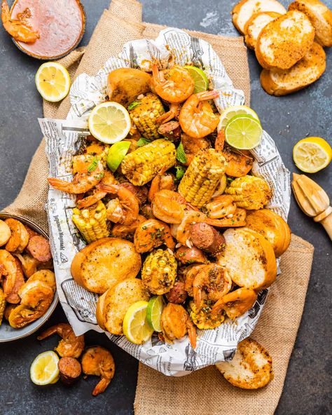 This Low Country Boil recipe is loaded with fresh shrimp, smoky sausage, sweet corn, and tender potatoes. Perfect meal for the family! Country Boil Recipe, Low Country Boil Recipe, Cooked Shrimp Recipes, Louisiana Seafood, Country Boil, Low Country Boil, Fresh Shrimp, Seafood Boil Recipes, Delicious Seafood Recipes