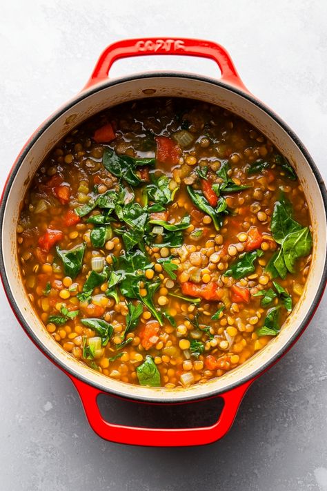 Warm up with a comforting bowl of lentil soup with spinach on a chilly evening. This hearty and healthy dish is loaded with nutritious ingredients that will keep you full and satisfied. The earthy lentils, vibrant spinach, and aromatic spices come together to create a flavorful soup that is perfect for lunch or dinner. Whether you're a vegetarian looking for a nutritious meal or just craving some homemade comfort food, this lentil soup with spinach recipe is sure to hit the spot. Lentil Soup With Spinach, Healthy Lentil Soup, Soup With Spinach, Soup Lovers, Homemade Comfort Food, Spinach Recipe, Lentil Soup Recipes, Green Lentils, Tomato Vegetable