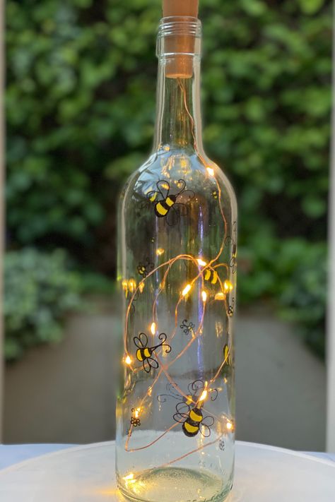 Hand Painted bottle with fairy light in Bumble Bee Design, perfect as a personalised gift for any occasion (especially with #mothersday right around the corner!) or as home décor to brighten any room. Each piece by Stephanie Designs is upcycled with care, all the way down to the recycled paper used for packaging, with sustainability and quality at the focus of every item sent. #giftsforher #sustainablegifting Crafting Workshop, Painting Bottles, Bottle Fairy Lights, Jars Ideas, Upcycled Home, Painted Bottles, Decorative Bottles, Light Up Bottles, Hand Painted Bottles