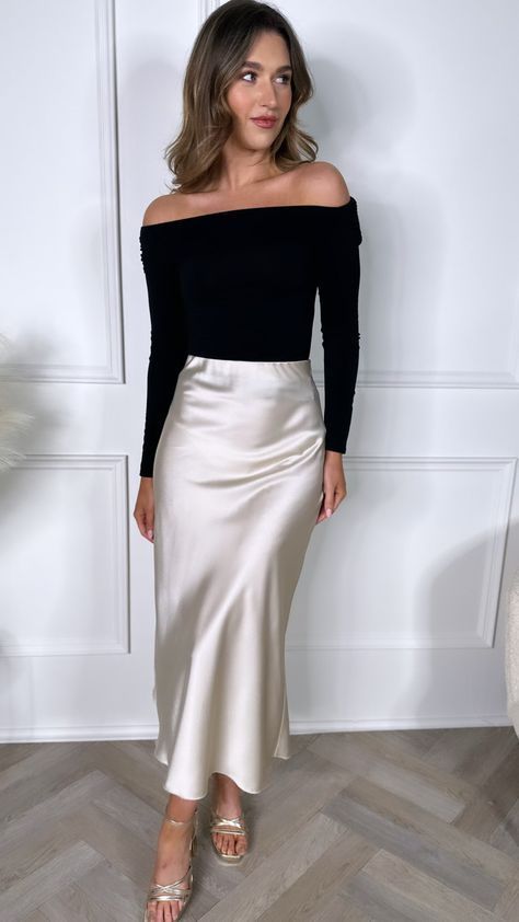 Midi Skirt Formal Outfit, Gold Satin Skirt Outfit Winter, Anthropology Work Outfit, Creme Satin Skirt Outfit, White Satin Skirt Outfit Winter, Silk Skirt Style, Tan Silk Skirt Outfit, Champagne Midi Skirt Outfit, Sleek Chic Style