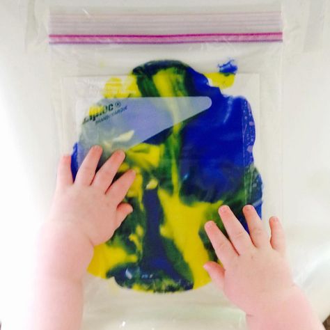 Paint-in-a-Bag 1 quart ziplock bag Paint (washable) Packing Tape Put your baby in their high-chair with a toy to play with while they wait for you. Squeeze paint into the bag. Completely seal the bag with as little air as possible. Tape down all four sides of the bag to their tray. Be sure the seal is facing away from them - just in case. Talk about the colors! Show them what to do. They'll be curious and excited by the colors. This craft helps them learn to associate appropriate responses ... Colors Show, Be Curious, Ziplock Bag, Fiji Water Bottle, Ziplock Bags, Play Ideas, Plan Ideas, Packing Tape, Baby Play