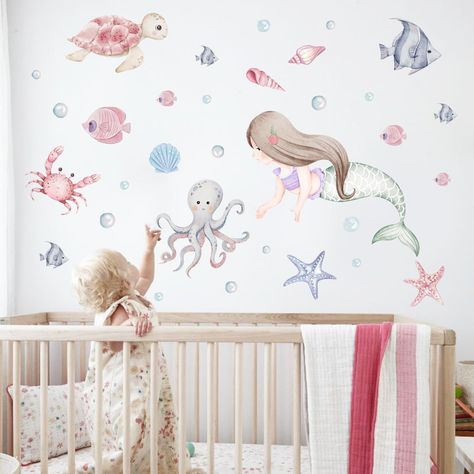 PRICES MAY VARY. ENCHANTING UNDERWATER MERMAID WALL DECAL: Immerse your little one in a whimsical journey beneath the waves with our captivating mermaid and ocean creature wall decals. Transform her room into an enchanting underwater wonderland, where her imagination can soar amidst vibrant designs that bring the ocean's beauty to life. SIMPLE TO APPLY: Crafted from eco-friendly materials, our wall decals offer a sustainable touch to your space. Effortlessly adhere to smooth surfaces, providing Little Mermaid Nursery Theme, Sea Nursery Girl, Mermaid Nursery Baby Girl, Daughter Nursery, Mermaid Nursery Theme, Aquarium Nursery, Little Mermaid Nursery, Ocean Kids Room, Underwater Wonderland