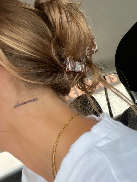 Neck Tattoo Cursive Writing, Amore Neck Tattoo, Day Dreamer Tattoo, Dreamer Tattoo Small, Neck Nape Tattoo, Writing Behind Ear Tattoo, Dream Tattoos Word, Behind The Ear Tattoo Ideas Words, Dainty Neck Tattoos