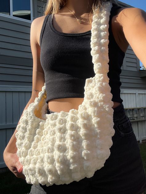 over the shoulder crochet bag using the popcorn stitch. perfect for cozy fall weather made with weight 6 bernat blanket yarn #crochet #crocheting #crochetbag #tutorial #crochettotebag #tutorial #aesthetic #popcornstitch #bubblestitch Crochet Bernat Yarn, Crochet Puffy Bag, Popcorn Stitch Crochet Bag, Bobble Bag Crochet, Aesthetic Crochet Bag Ideas, Bubble Stitch Crochet Bag, Cute Crochet Bag Aesthetic, Crochet Shoulder Bags Aesthetic, Chenille Crochet Bag